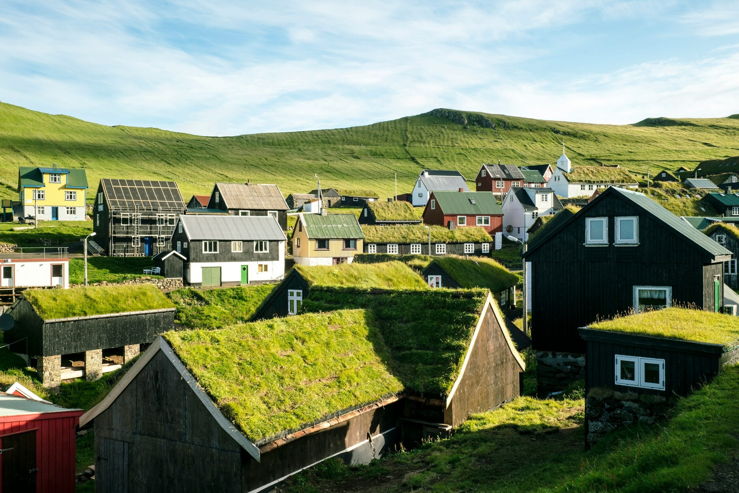 Traditional Faroese celebration with people gathering for community meal