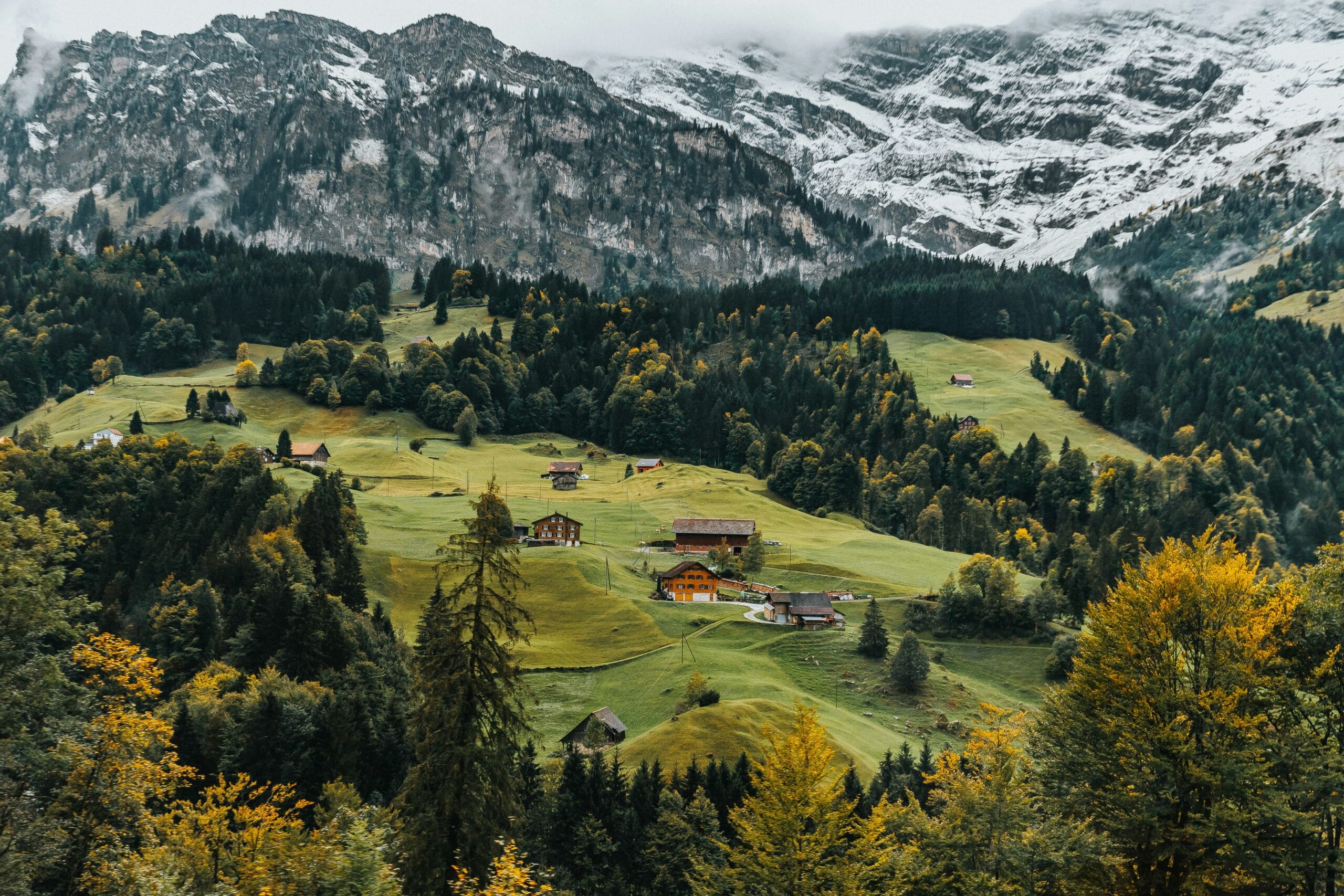 Swiss alpine village in winter with snow-covered peaks
